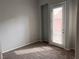 Bright bedroom with a glass door leading to a balcony, perfect for enjoying natural light at 10067 Sand Key St, Las Vegas, NV 89178