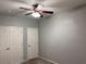 Neutral bedroom with a ceiling fan and double door closet at 10067 Sand Key St, Las Vegas, NV 89178