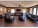 Inviting common room with ample seating, flat-screen TV, and natural light at 10067 Sand Key St, Las Vegas, NV 89178