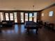 Entertaining common room with a pool table, comfortable seating, and plenty of natural light at 10067 Sand Key St, Las Vegas, NV 89178