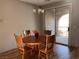 Eat-in dining area with a wooden table set and a sliding glass door to the outdoor balcony at 10067 Sand Key St, Las Vegas, NV 89178