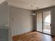 Open dining area features wood floors and a sliding glass door to the patio at 10067 Sand Key St, Las Vegas, NV 89178