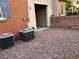 Exterior shot with AC units and low maintenance desert landscaping at 10067 Sand Key St, Las Vegas, NV 89178