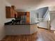 Spacious kitchen with a breakfast bar, stainless steel appliances, and wood floor at 10067 Sand Key St, Las Vegas, NV 89178