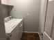 Convenient laundry room with a washer and dryer, and practical shelving at 10067 Sand Key St, Las Vegas, NV 89178