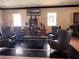Comfortable resident lounge with plush leather seating and a relaxing atmosphere at 10067 Sand Key St, Las Vegas, NV 89178
