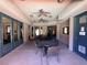 Inviting outdoor patio area with tables and ceiling fans at 10067 Sand Key St, Las Vegas, NV 89178