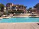 Beautiful community pool with lounge area and well-maintained landscaping at 10067 Sand Key St, Las Vegas, NV 89178