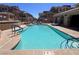 Community pool offering a refreshing escape, surrounded by well-maintained landscaping at 10067 Sand Key St, Las Vegas, NV 89178