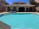 Relaxing pool with lounge chairs and a shaded seating area, ideal for outdoor enjoyment at 10067 Sand Key St, Las Vegas, NV 89178