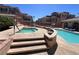 Community pool area featuring a spa and comfortable lounging spaces, perfect for relaxation at 10067 Sand Key St, Las Vegas, NV 89178