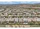Expansive aerial view of a suburban neighborhood with well-maintained homes and desert mountain backdrop at 10808 Wallflower Ave, Las Vegas, NV 89135
