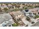 Aerial of a residential street with mature trees and houses with desert landscaping at 10808 Wallflower Ave, Las Vegas, NV 89135
