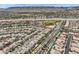 Aerial view of a neighborhood with mountain views and nearby community park at 10808 Wallflower Ave, Las Vegas, NV 89135