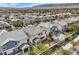 Aerial view of the home and backyard, neighboring houses, and well-planned community at 10808 Wallflower Ave, Las Vegas, NV 89135