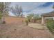 Spacious backyard with low-maintenance desert landscaping and block wall at 10808 Wallflower Ave, Las Vegas, NV 89135