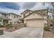 Charming two-story home with a well-manicured yard and a two-car attached garage at 10808 Wallflower Ave, Las Vegas, NV 89135