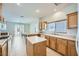 Bright kitchen featuring light wood cabinets, tile floors, and a view of the outdoor dining space at 10808 Wallflower Ave, Las Vegas, NV 89135
