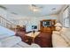 Spacious living area featuring a fireplace, built-in cabinet, and open flow to dining room at 10808 Wallflower Ave, Las Vegas, NV 89135