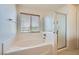 Relaxing main bathroom featuring a soaking tub, walk-in shower, and natural light at 10808 Wallflower Ave, Las Vegas, NV 89135