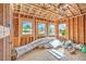 Unfinished bonus room with bright natural light and windows framing views of neighborhood homes at 18 Placa De Rei Ct, Henderson, NV 89011
