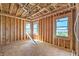Unfinished bonus room featuring bright natural light and windows framing a view of hills in the distance at 18 Placa De Rei Ct, Henderson, NV 89011