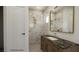 Stylish ensuite bathroom featuring a walk-in shower with gold fixtures and a marble vanity at 18 Placa De Rei Ct, Henderson, NV 89011