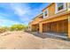 Exterior elevation featuring wood framing and an empty lot ready for landscaping at 18 Placa De Rei Ct, Henderson, NV 89011
