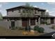 Two story home showcasing desert landscaping, a tile roof, 3-car garage, and a stone and stucco facade at 18 Placa De Rei Ct, Henderson, NV 89011