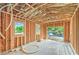Wood framing with windows of unfinished space under construction, awaiting customization and finishing touches at 18 Placa De Rei Ct, Henderson, NV 89011