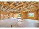 Interior view of home under construction with exposed beams, large window showcasing expansive outdoor views at 18 Placa De Rei Ct, Henderson, NV 89011