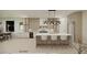 Bright kitchen featuring a center island with a marble countertop and modern pendant lighting at 18 Placa De Rei Ct, Henderson, NV 89011