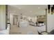 Modern kitchen seamlessly flowing into living area with beautiful finishes and fireplace at 18 Placa De Rei Ct, Henderson, NV 89011