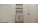 Convenient laundry room with storage cabinets, elegant countertops, and easy access door at 18 Placa De Rei Ct, Henderson, NV 89011