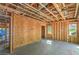 Unfinished living room featuring wood framing, visible wiring and duct work, and concrete floors ready to be customized at 18 Placa De Rei Ct, Henderson, NV 89011