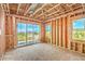 Unfinished living room with sliding glass doors framing a view of hills in the distance at 18 Placa De Rei Ct, Henderson, NV 89011