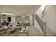 Modern living room boasts an open-concept design, seamlessly blending with a stylish kitchen and dining area at 18 Placa De Rei Ct, Henderson, NV 89011