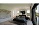Primary bedroom with modern decor, recessed lights, and access to the backyard at 18 Placa De Rei Ct, Henderson, NV 89011