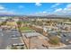 Aerial view of a neighborhood basketball court with lush green field, offering recreational opportunities at 2130 E Maule Ave, Las Vegas, NV 89119