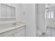 Bathroom featuring a vanity sink, a mirror and tiled shower-tub combo, functionality and style at 2130 E Maule Ave, Las Vegas, NV 89119
