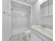 Well-lit bathroom featuring a shower-tub combo, white fixtures, and clean, functional design at 2130 E Maule Ave, Las Vegas, NV 89119