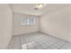 Bright bedroom with tile flooring and ample natural light, creating a comfortable and inviting atmosphere at 2130 E Maule Ave, Las Vegas, NV 89119