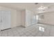 Large bonus room offers versatile space with tile flooring, multiple closets, and a window at 2130 E Maule Ave, Las Vegas, NV 89119