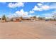 Spacious property showcasing a large dirt parking area and building, ideal for commercial or residential use at 2130 E Maule Ave, Las Vegas, NV 89119