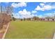 View of the spacious artificial turf field, surrounded by trees and landscaping, perfect for outdoor activities and relaxation at 2130 E Maule Ave, Las Vegas, NV 89119