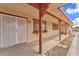 Covered porch with decorative door and window boxes, offering curb appeal at 2130 E Maule Ave, Las Vegas, NV 89119