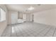 Bright laundry room with included washer and dryer, tile flooring, and convenient access to other areas at 2130 E Maule Ave, Las Vegas, NV 89119