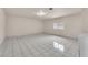 Bright living room with white tile flooring and a window providing natural light at 2130 E Maule Ave, Las Vegas, NV 89119