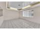 Bright living room with large window and tile flooring provides an inviting space for relaxation at 2130 E Maule Ave, Las Vegas, NV 89119