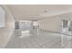 Open floor plan featuring tile floors and a seamless transition to the kitchen for easy living and entertaining at 2130 E Maule Ave, Las Vegas, NV 89119